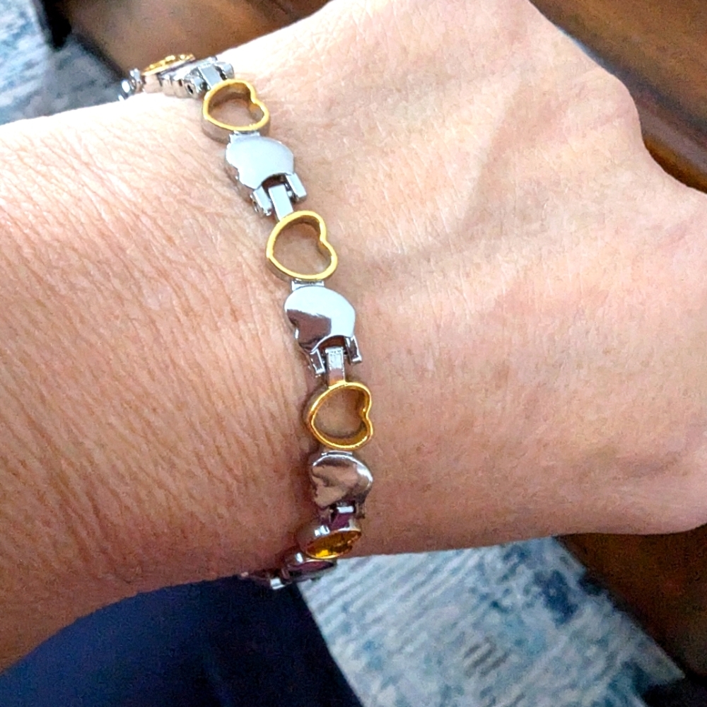 - - 2 toned tennis bracelet. Silver and Gold toned. 8 inches. Hearts.…